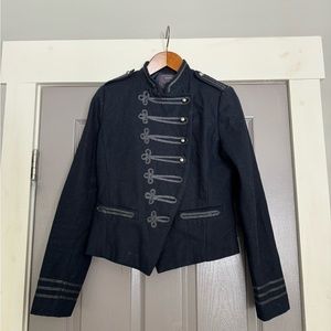 Woman’s fashionable blue bolero jacket double breasted look with buttons